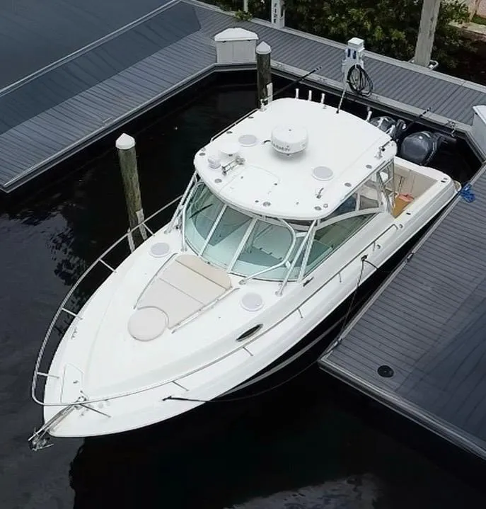 Slide: The Image of 2014 Wellcraft 340 Coastal boat docked at marina, aerial view. - 0