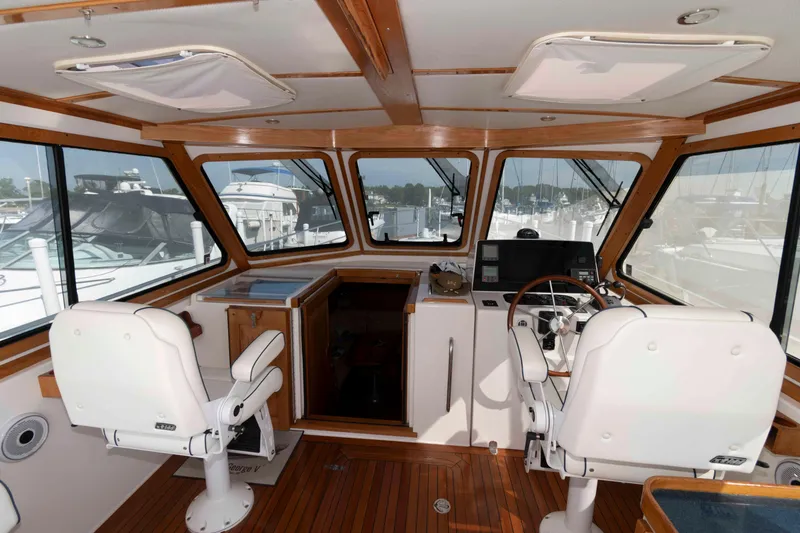 Slide: The Image of Interior of 2003 Sabre 42 Express yacht with helm station and seating. - 10