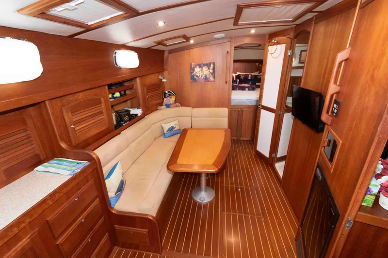 Slide: The Image of Luxurious interior of 2003 Sabre 42 Express yacht with wooden furnishings and cozy seating area. - 20