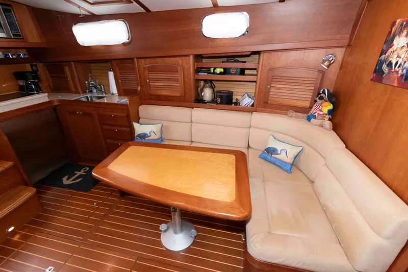 Slide: The Image of Interior of 2003 Sabre 42 Express yacht with cozy seating and wooden finishes. - 22