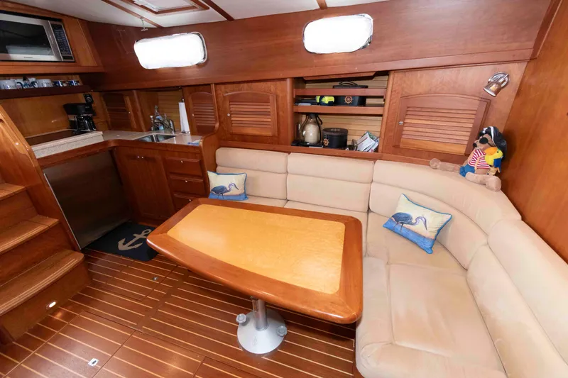Slide: The Image of Luxurious interior of 2003 Sabre 42 Express yacht with cozy seating and kitchenette. - 23