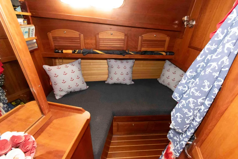 Slide: The Image of Cozy cabin interior of 2003 Sabre 42 Express with nautical-themed decor. - 26