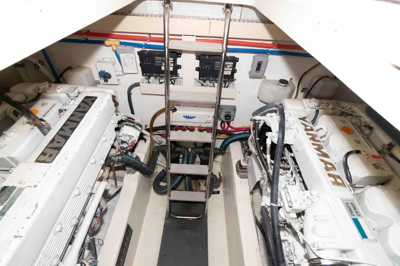 Slide: The Image of Engine room of 2003 Sabre 42 Express yacht with Yanmar engines and control panels. - 29
