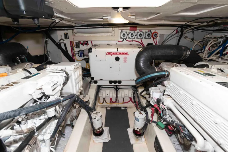 Slide: The Image of Engine room of 2003 Sabre 42 Express yacht with Westerbeke generator and dual engines. - 30