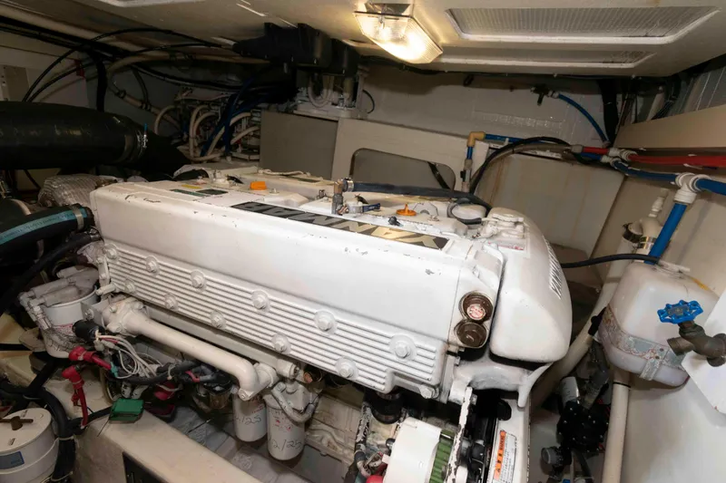 Slide: The Image of Engine room of 2003 Sabre 42 Express yacht, showcasing detailed mechanical components. - 31