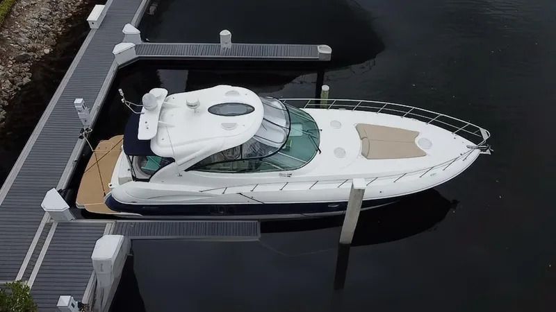 Slide: The Image of 2005 Cruisers Yachts 500 Express docked, aerial view, sleek design, luxury motor yacht. - 6