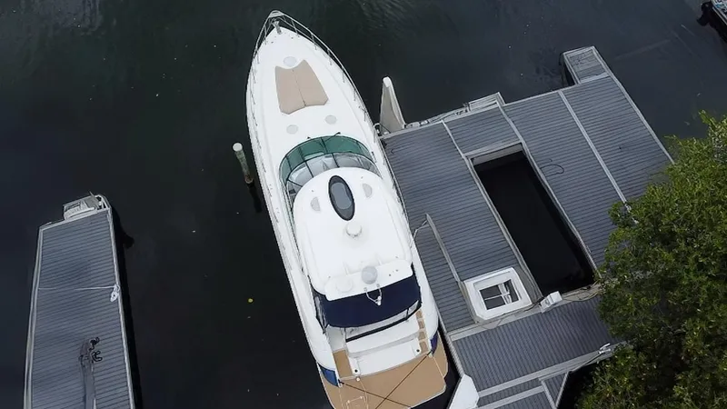 Slide: The Image of Overhead view of a 2005 Cruisers Yachts 500 Express docked at a marina. - 10