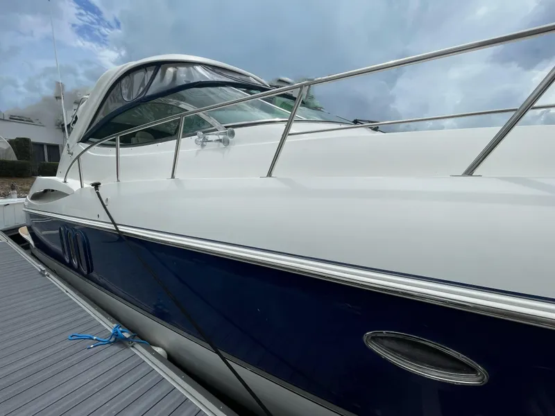 Slide: The Image of 2005 Cruisers Yachts 500 Express docked, showcasing sleek design and modern features. - 4