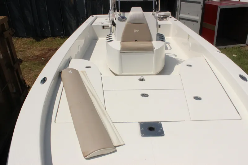 Slide: The Image of 2011 Ranger 2400 Bay Ranger boat interior with seating and storage compartments. - 14