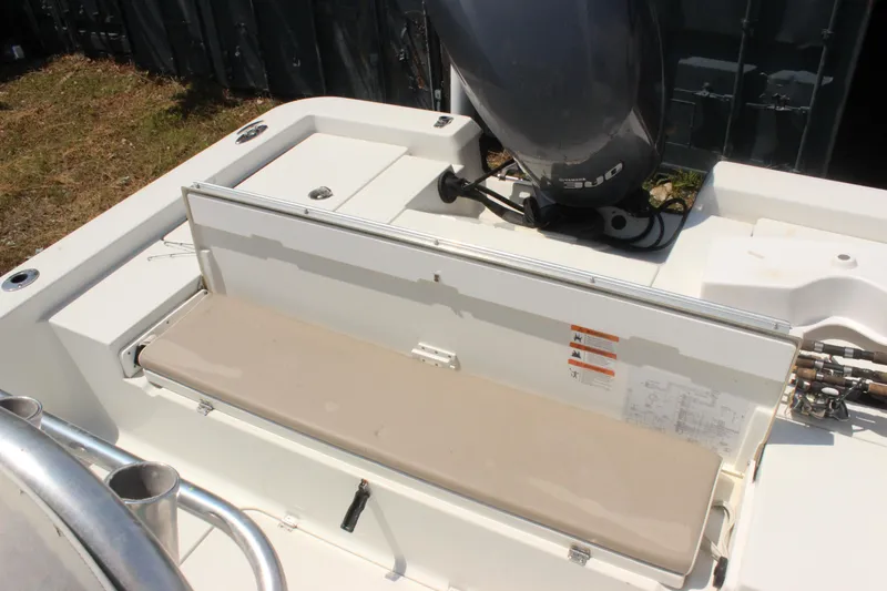Slide: The Image of 2011 Ranger 2400 Bay Ranger boat with outboard motor and seating area. - 18