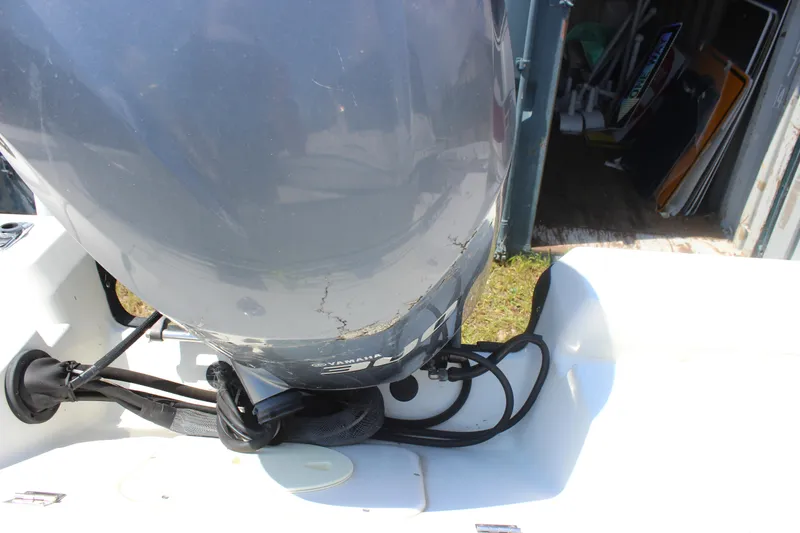 Slide: The Image of Outboard motor on 2011 Ranger 2400 Bay Ranger boat, close-up view. - 19