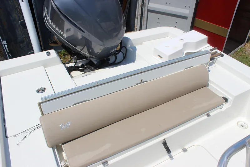 Slide: The Image of 2011 Ranger 2400 Bay Ranger boat with Yamaha outboard motor and beige seating. - 22