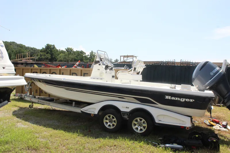 Slide: The Image of 2011 Ranger 2400 Bay Ranger boat on trailer, parked outdoors. - 8