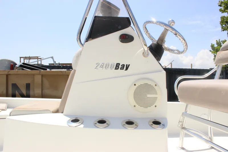 Slide: The Image of 2011 Ranger 2400 Bay Ranger boat console with steering wheel and speaker. - 9