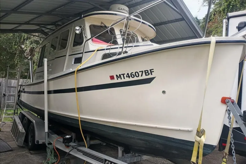 Slide: The Image of 2005 Rosborough RF-246 Sedan Cruiser on trailer under shelter. - 11