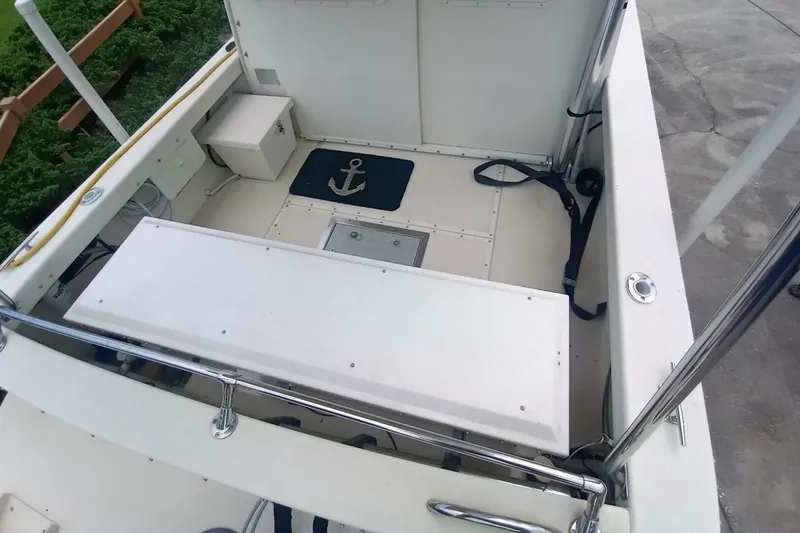 Slide: The Image of 2005 Rosborough RF-246 Sedan Cruiser deck with anchor mat and seating area. - 12