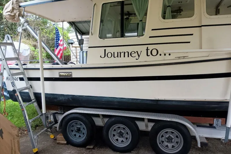 Slide: The Image of 2005 Rosborough RF-246 Sedan Cruiser on trailer with "Journey to..." text. - 14