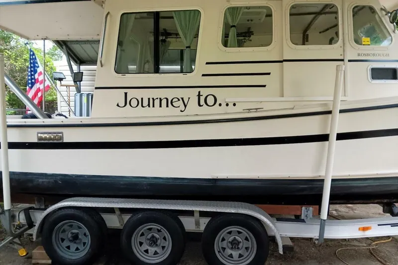 Slide: The Image of 2005 Rosborough RF-246 Sedan Cruiser on trailer with "Journey to..." text. - 16