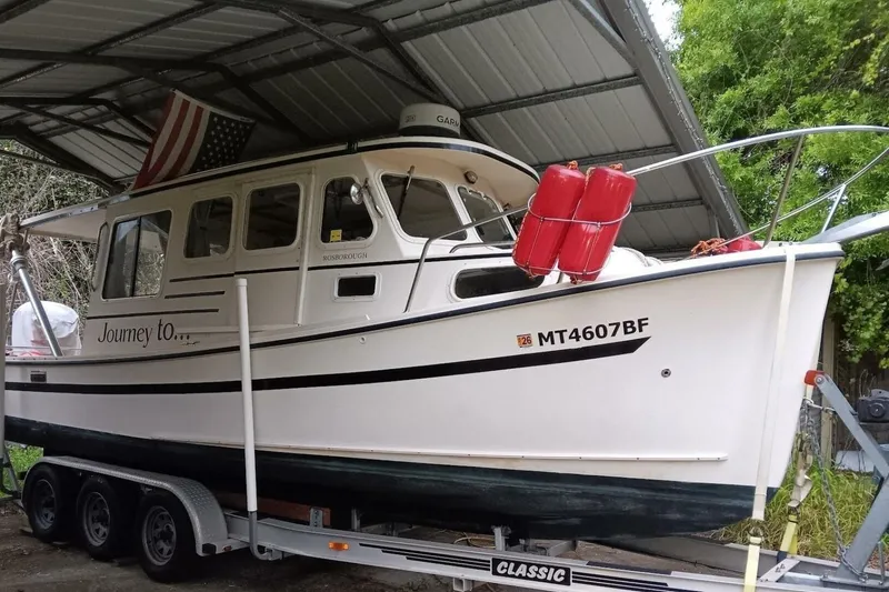 Slide: The Image of 2005 Rosborough RF-246 Sedan Cruiser on trailer under metal shelter. - 18