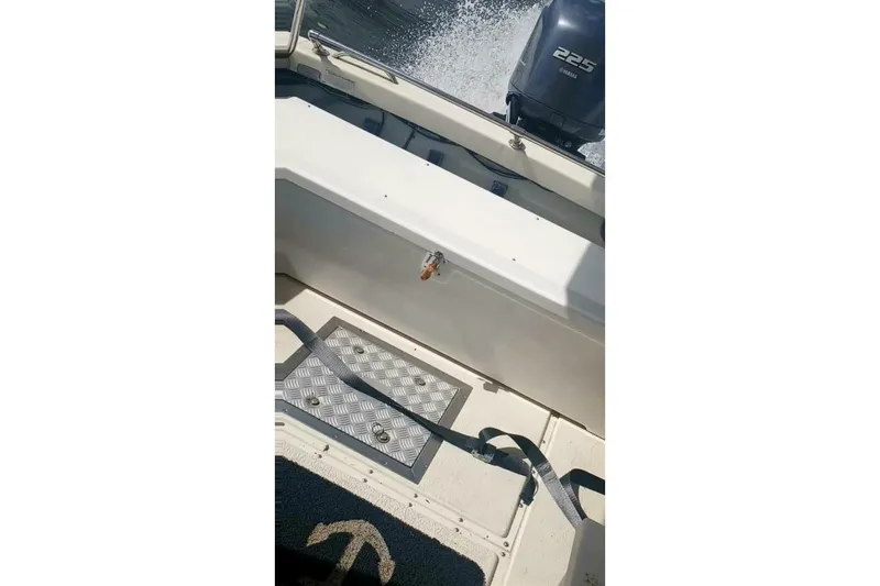 Slide: The Image of 2005 Rosborough RF-246 Sedan Cruiser interior with Yamaha 225 engine visible. - 24