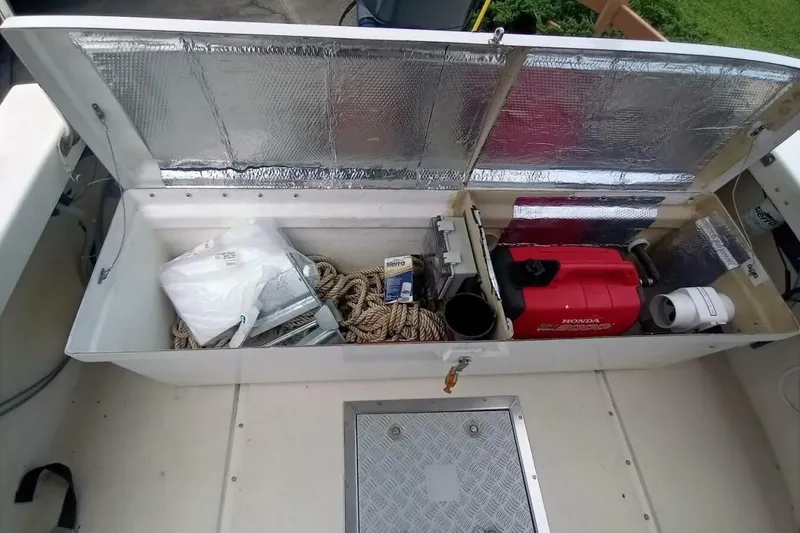 Slide: The Image of Open storage compartment on 2005 Rosborough RF-246 Sedan Cruiser with ropes and equipment. - 29