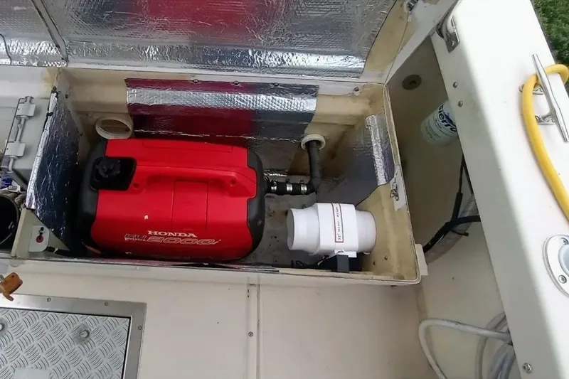 Slide: The Image of Open compartment in 2005 Rosborough RF-246 Sedan Cruiser with Honda generator and equipment. - 30