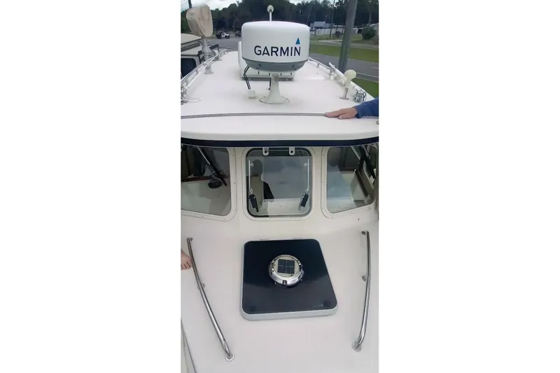Slide: The Image of 2005 Rosborough RF-246 Sedan Cruiser with Garmin radar on deck. - 31