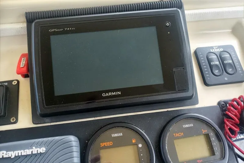 Slide: The Image of Control panel of a 2005 Rosborough RF-246 Sedan Cruiser with Garmin GPS and Yamaha gauges. - 42