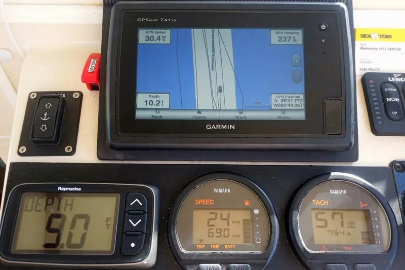 Slide: The Image of 2005 Rosborough RF-246 Sedan Cruiser dashboard with Garmin GPS and Yamaha gauges. - 43