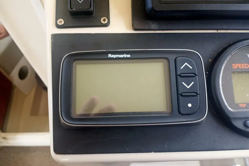 Slide: The Image of Raymarine display on 2005 Rosborough RF-246 Sedan Cruiser dashboard, showing navigation controls. - 45