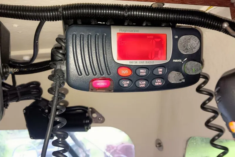 Slide: The Image of VHF radio on 2005 Rosborough RF-246 Sedan Cruiser, featuring distress button and controls. - 46