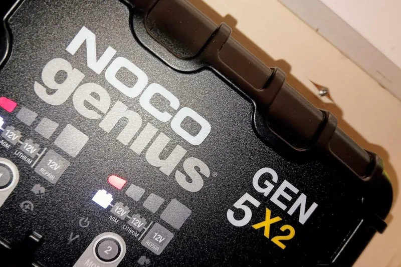 Slide: The Image of NOCO Genius GEN 5X2 battery charger, close-up view, highlighting features and indicators. - 47