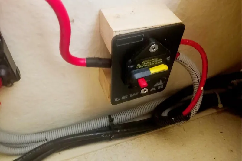 Slide: The Image of 2005 Rosborough RF-246 Sedan Cruiser electrical panel with red wiring and switch. - 49