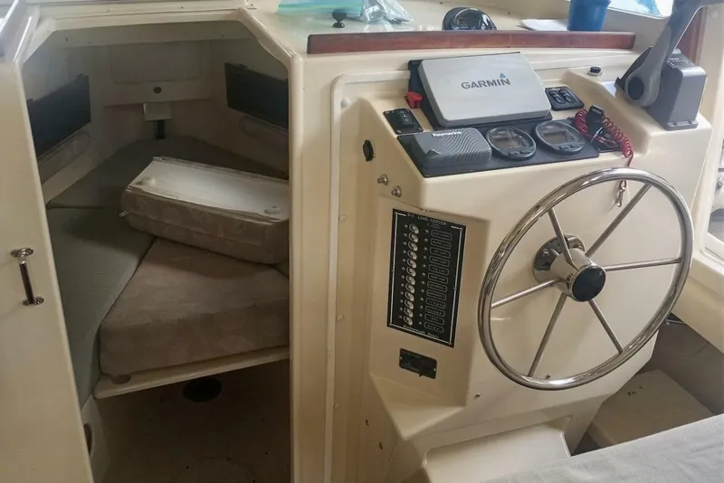 Slide: The Image of 2005 Rosborough RF-246 Sedan Cruiser interior with steering wheel and navigation equipment. - 5