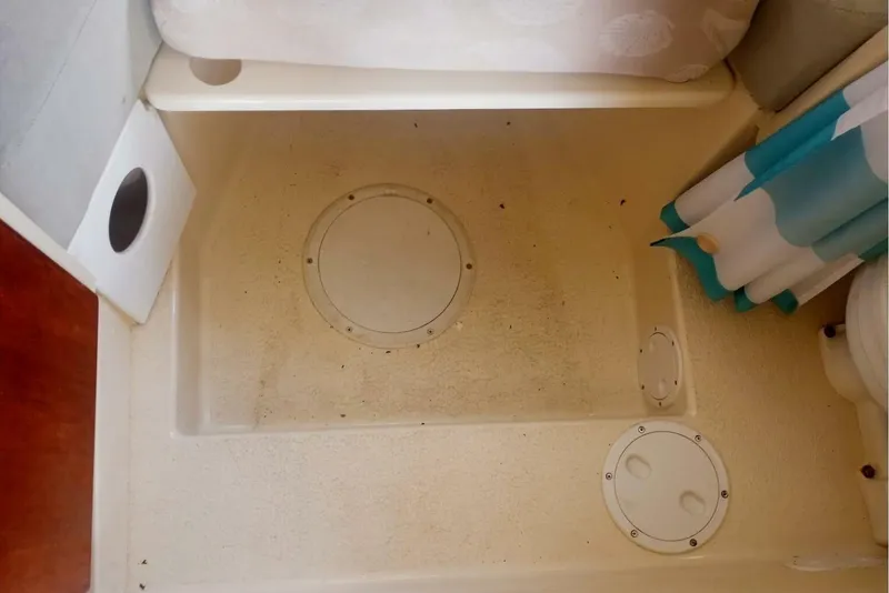 Slide: The Image of 2005 Rosborough RF-246 Sedan Cruiser interior shower area with circular access panels. - 55