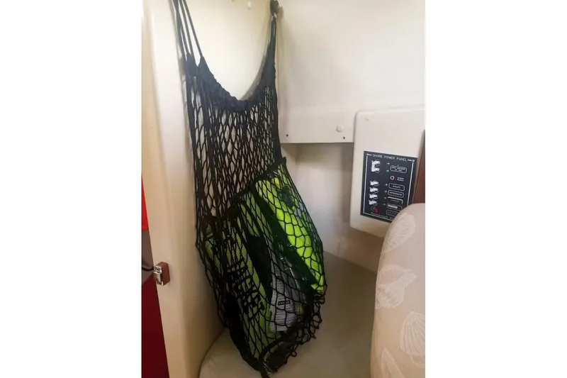 Slide: The Image of Net storage with life jackets in 2005 Rosborough RF-246 Sedan Cruiser interior. - 57