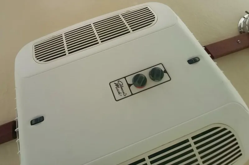 Slide: The Image of Close-up of a climate control unit inside a 2005 Rosborough RF-246 Sedan Cruiser. - 60