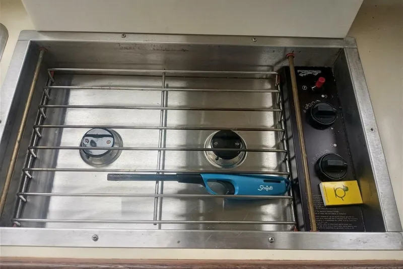 Slide: The Image of Stainless steel stove with controls on a 2005 Rosborough RF-246 Sedan Cruiser. - 65