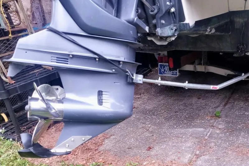 Slide: The Image of 2005 Rosborough RF-246 Sedan Cruiser outboard motor and propeller on a trailer. - 8