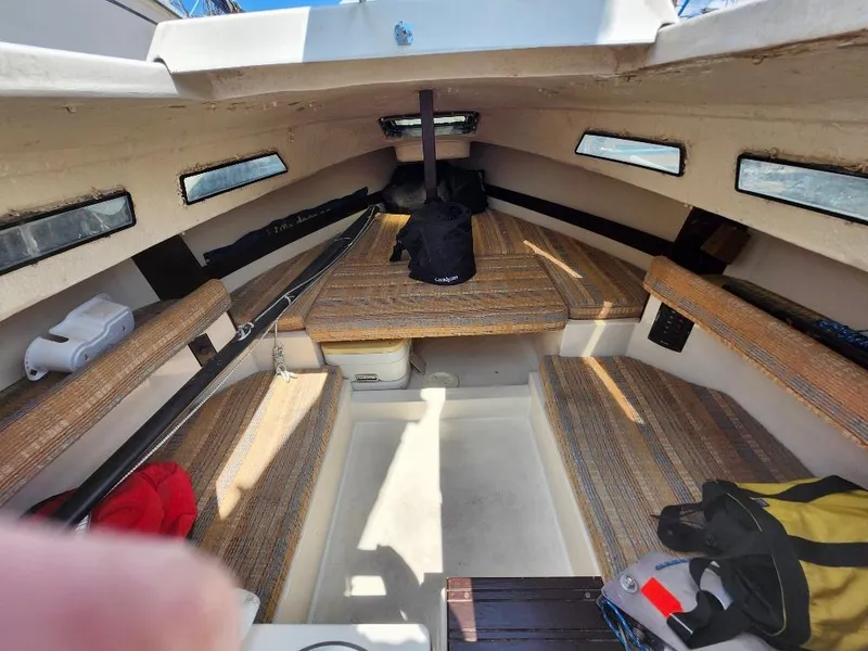 Slide: The Image of Interior of a 1982 Starwind 19 sailboat with seating and storage. - 2