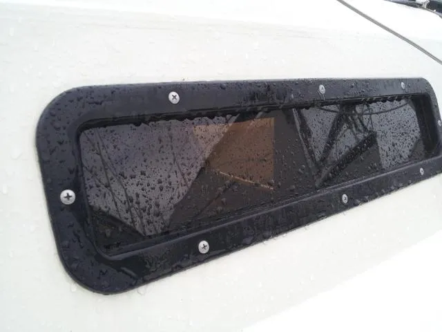 Slide: The Image of Raindrops on Starwind 19 boat window, 1982 model, close-up view. - 24