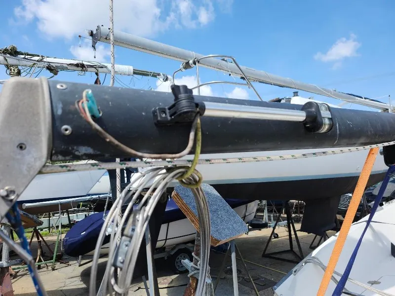 Slide: The Image of Close-up of a 1982 Starwind 19 sailboat mast and rigging under a clear sky. - 27