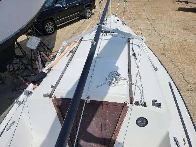 Slide: The Image of 1982 Starwind 19 sailboat on dry dock, showing deck and rigging details. - 28