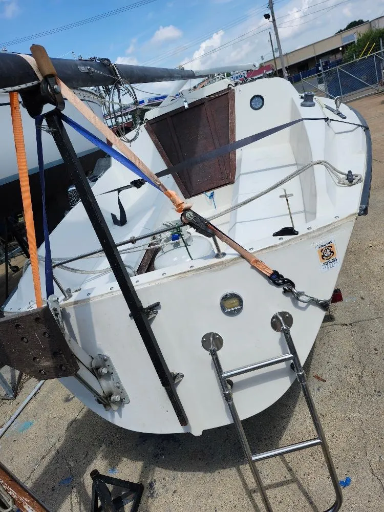 Slide: The Image of 1982 Starwind 19 sailboat on trailer, showing stern and cockpit details. - 30