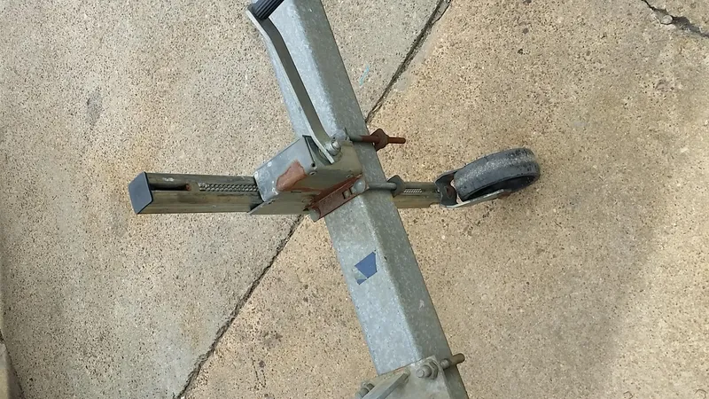 Slide: The Image of Trailer hitch with wheel on concrete, Starwind 19, 1982 model. - 31