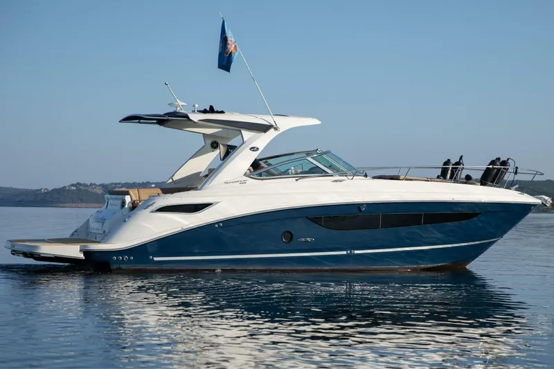 Slide: The Image of 2016 Sea Ray 350 Sundancer yacht on calm water, side view. - 1