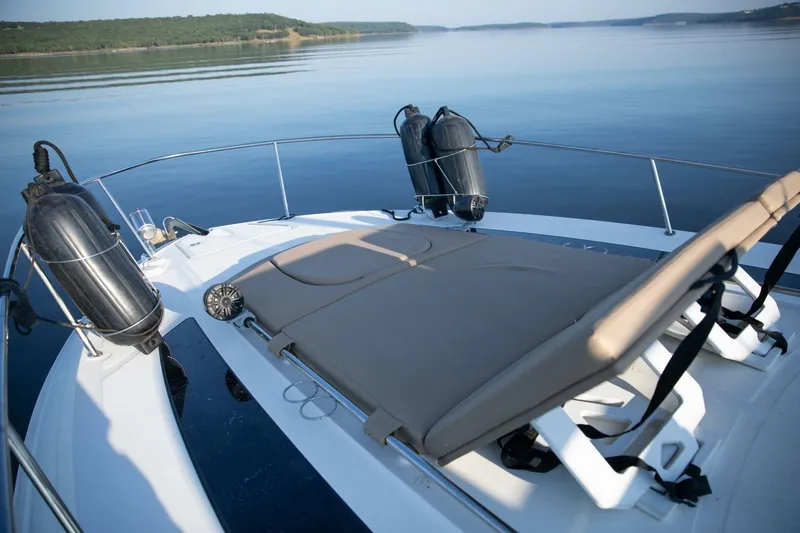 Slide: The Image of 2016 Sea Ray 350 Sundancer yacht docked with blue cover in marina. - 11