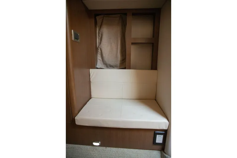 Slide: The Image of Control panel of a 2016 Sea Ray 350 Sundancer boat with various switches and displays. - 117