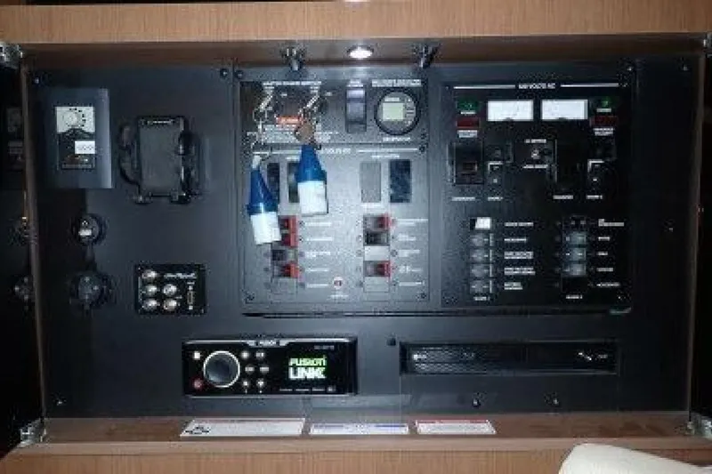 Slide: The Image of Interior of 2016 Sea Ray 350 Sundancer with wood paneling and window. - 118