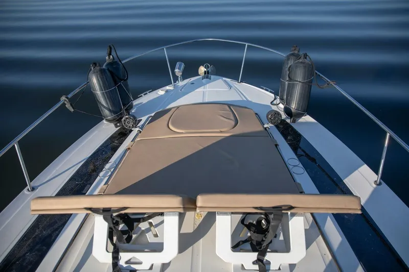 Slide: The Image of 2016 Sea Ray 350 Sundancer yacht docked at marina, featuring sleek design and spacious deck. - 17